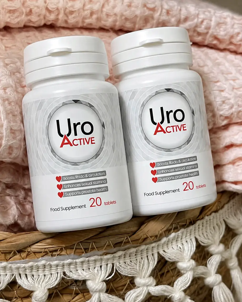 Dve dózy Uro Active po 20 tabletách na ružovom plede, dve balenia doplnku stravy na 20 dní